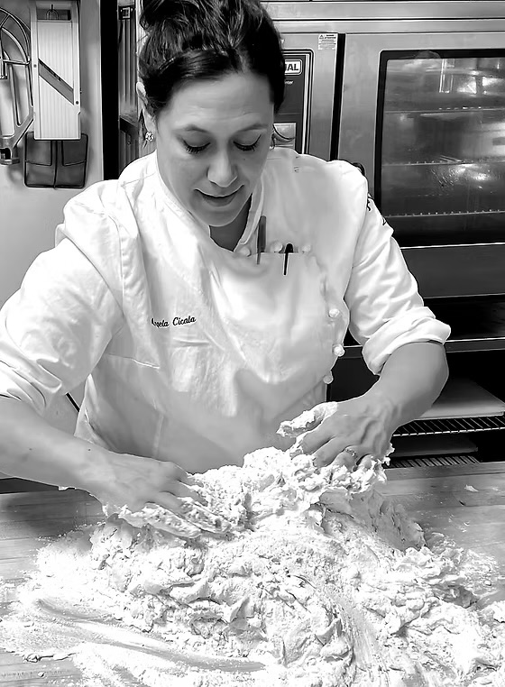 Pastry Chef Angela Cicala working fresh dough by hand.